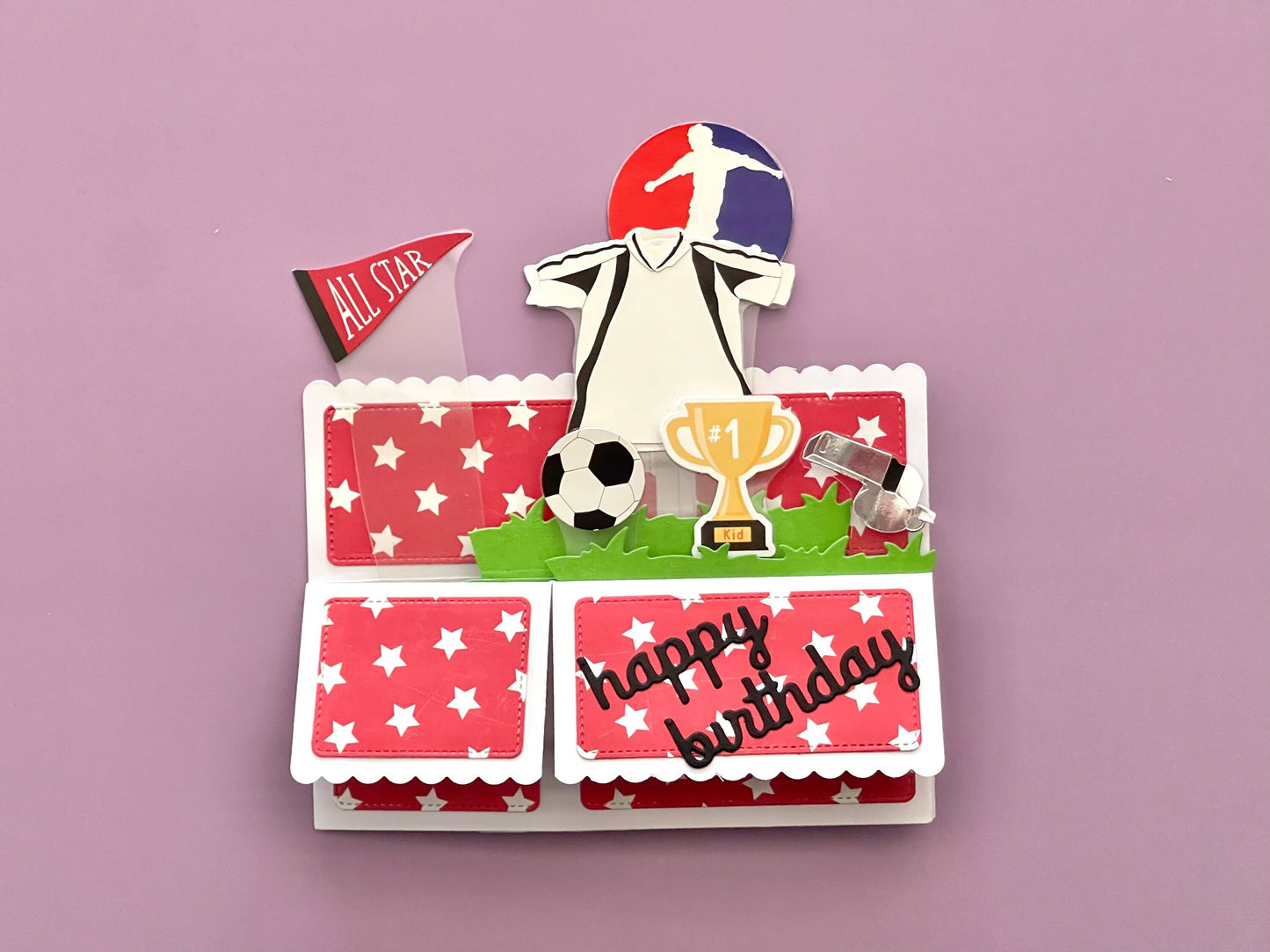 Soccer-themed birthday card with a player, trophy, and 'All Star' flag on a pink background