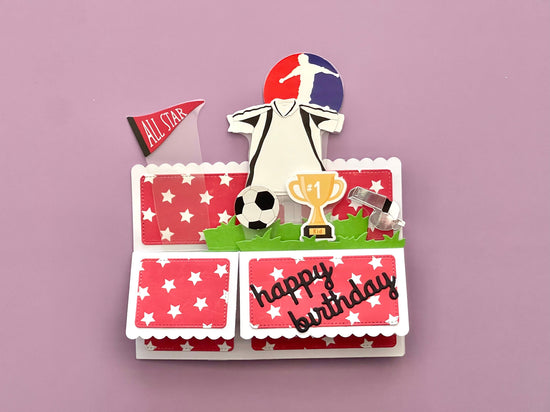 Soccer-themed birthday card with a player, trophy, and 'All Star' flag on a pink background