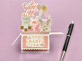 3D box pop-up card for baby girl with pink and white polka dots.  Shows an elephant, owl, flamingo and butterflies.