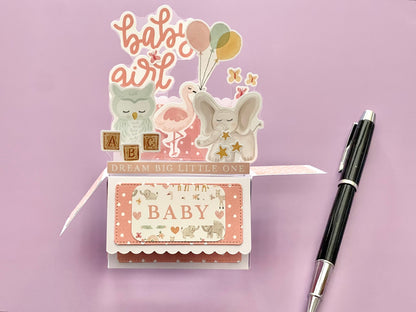3D box pop-up card for baby girl with pink and white polka dots.  Shows an elephant, owl, flamingo and butterflies.