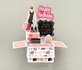 Decorative birthday card with shopping theme and 'Happy Birthday' text.