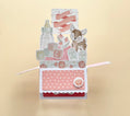 3D box pop-up  baby card with a deer illustration, baby bottle, and flowers on a beige background