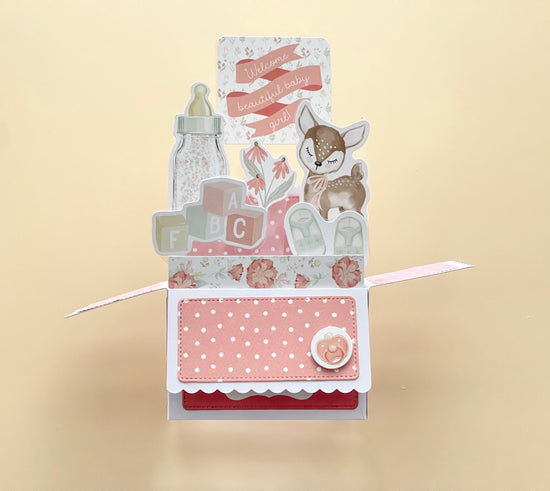 3D box pop-up  baby card with a deer illustration, baby bottle, and flowers on a beige background