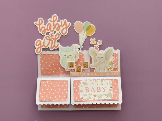 Decorative baby card with elephants and text on a purple background