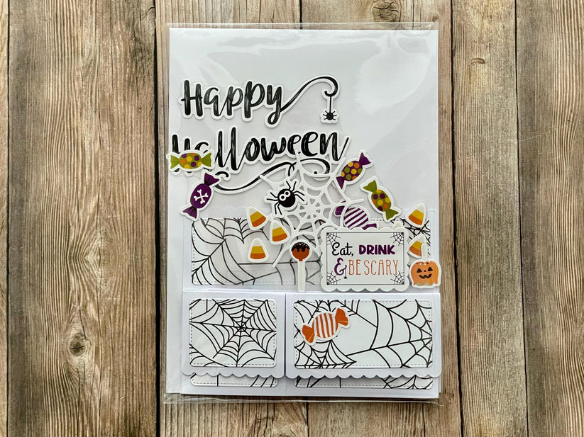 Halloween-themed pop-up card on a wooden surface
