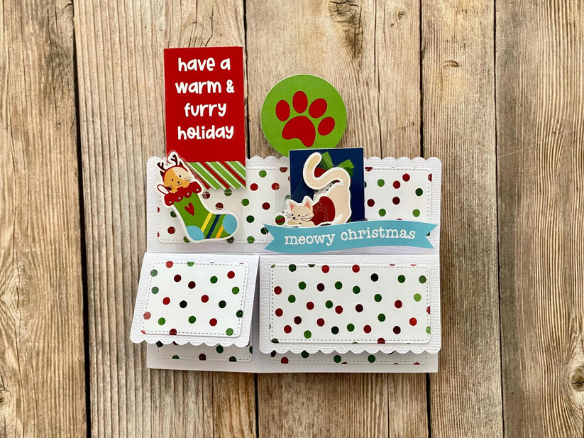 Christmas-themed card with paw prints and text on a wooden background