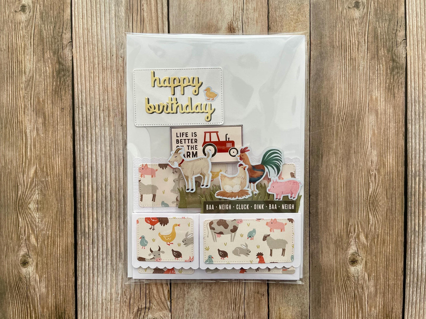 Birthday card with farm animal illustrations on a wooden background