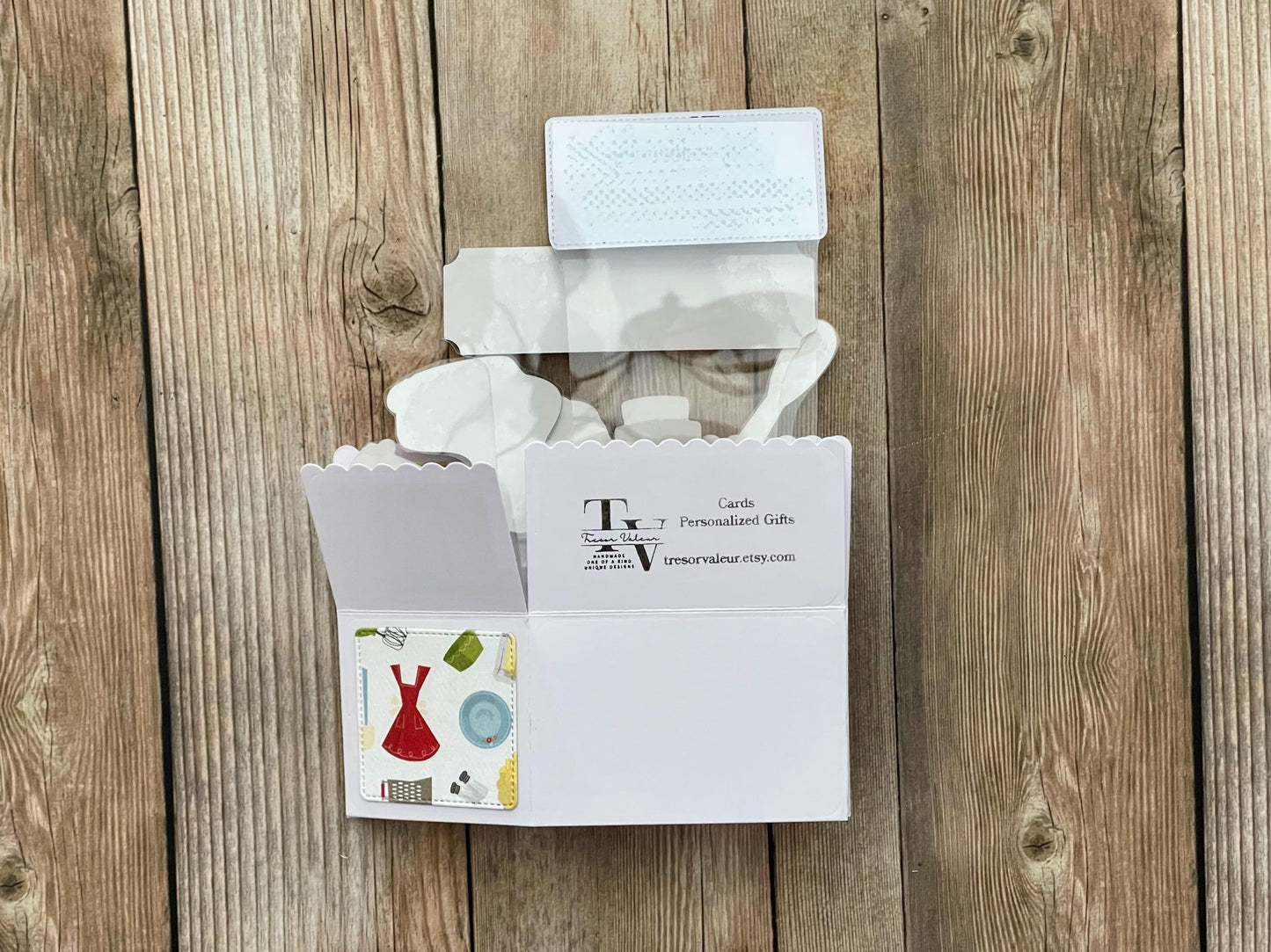 Back of folded box style pop-up card with baking theme.
